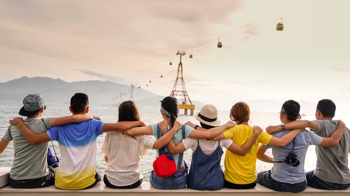 A group of friends sitting together looking out at the horizon